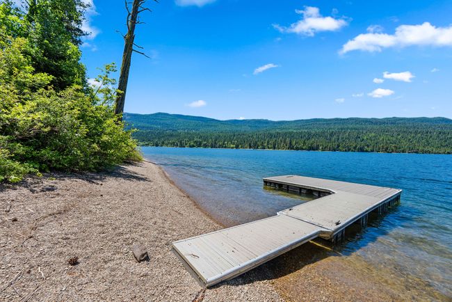 Dock area with a view of trees and a water view | Image 5