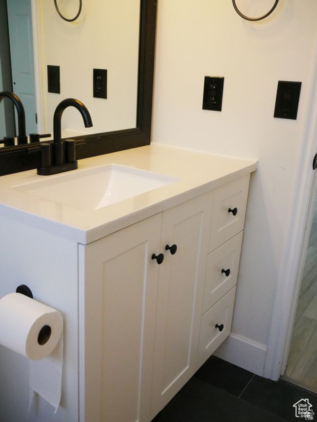 Bathroom with vanity and tile patterned floors | Image 14