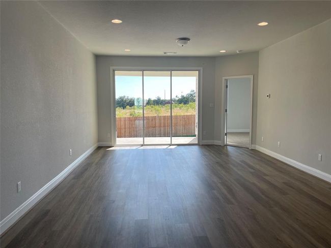 Unfurnished room featuring dark wood-style floors and recessed lighting | Image 6