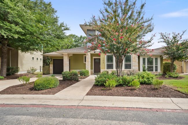 The beautiful landscaping, carefully maintained by the HOA, sets the stage for an inviting and well-kept exterior | Image 4