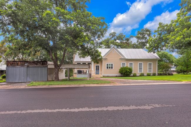 View of front facade featuring a metal roof and a front lawn | Image 37