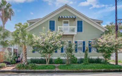 Galveston Historical home w/architectural details and elegant design, this residence offers a unique opportunity to own a slice of history while enjoying modern comforts. The home boasts a stunning curb appeal, highlighted by charming shutters adorning its numerous windows. | Image 1