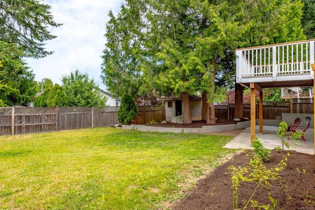 Fully fenced backyard with shed | Image 91