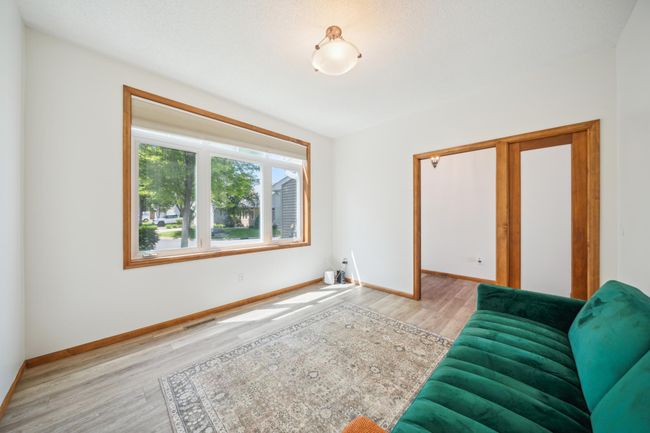 Located on the main level, this versatile room is the ultimate flex space—perfect for a quiet home office, comfortable guest room, home gym, or whatever fits your lifestyle. | Image 18