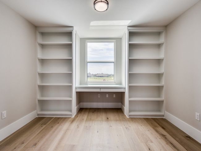 Upstairs Desk -Study Area with custom build in desk with glass top and built in custom bookshelves | Image 38