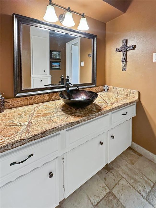 Secondary full restroom conveniently located near the bedrooms and offers updates all around. | Image 22