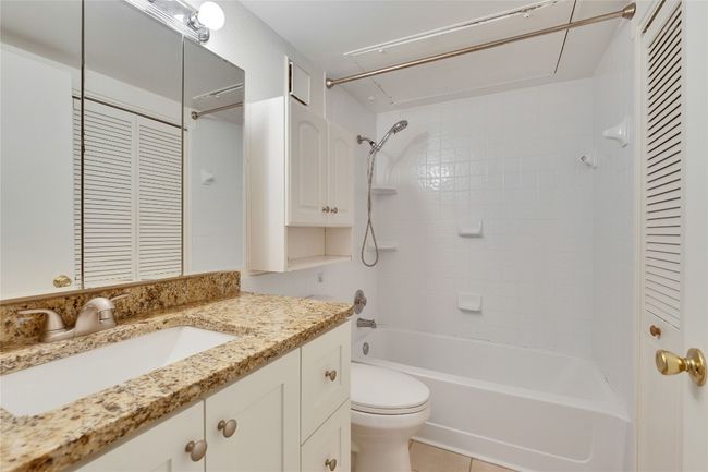 Bathroom with vanity and tub / shower combination | Image 22