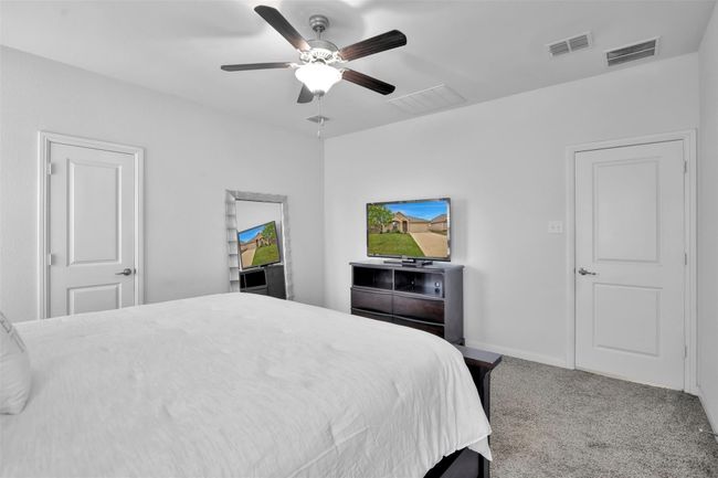 Bedroom featuring carpet flooring and a ceiling fan | Image 14