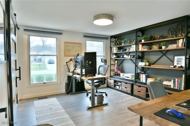 Office with wood finished floors, baseboards, and visible vents | Image 20