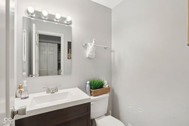 half bathroom with toilet and vanity | Image 19