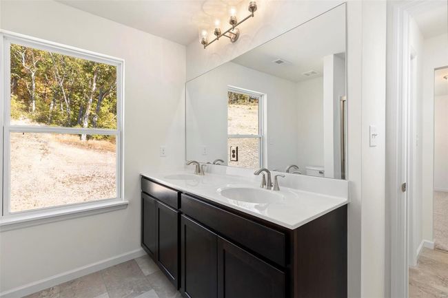 Bathroom with vanity, plenty of natural light, and toilet | Image 6
