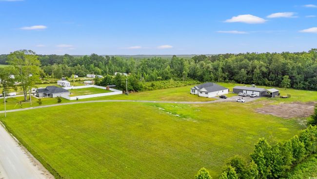View from above of property featuring a heavily wooded area | Image 40