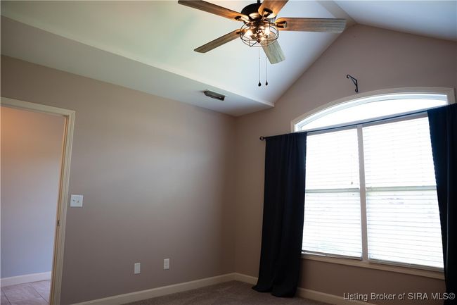 Guest bedroom with vaulted ceiling & upgraded ceiling fans | Image 4