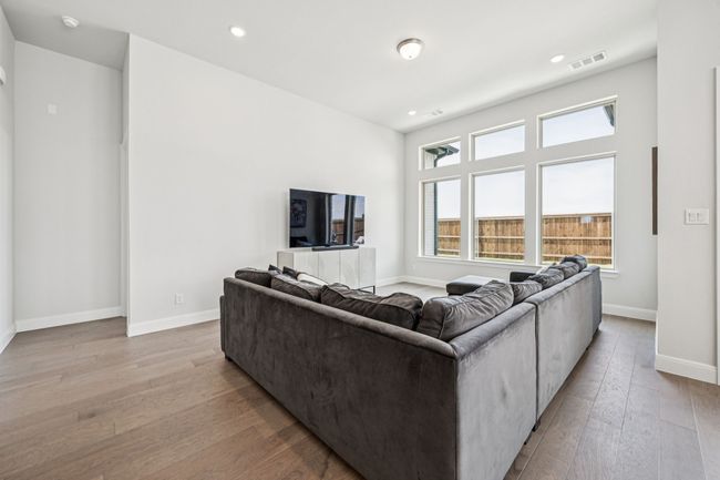 Living area featuring wood-type flooring, baseboards, and recessed lighting | Image 24
