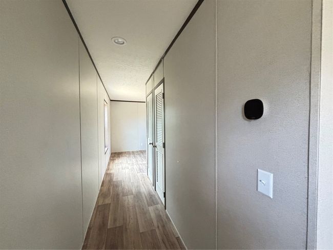 Hallway featuring wood lookfinished floors and baseboards | Image 13
