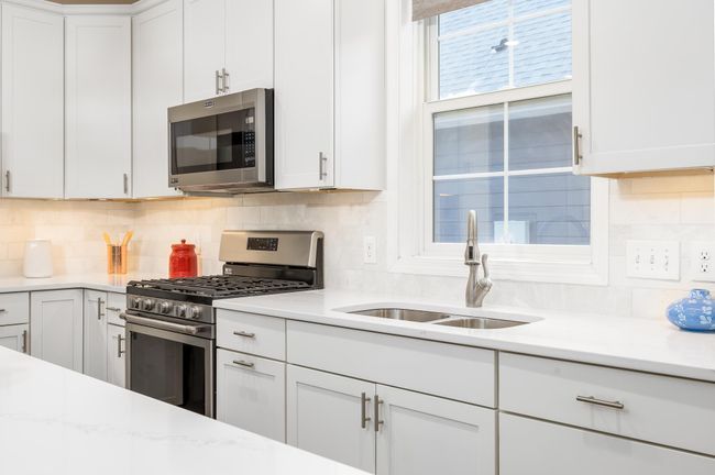 Open concept kitchen with a spacious island. | Image 7