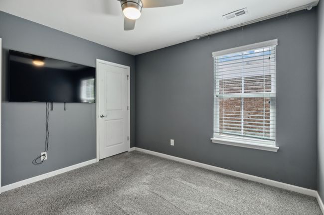 BR 2 features a ceiling fan and walk in closet | Image 25