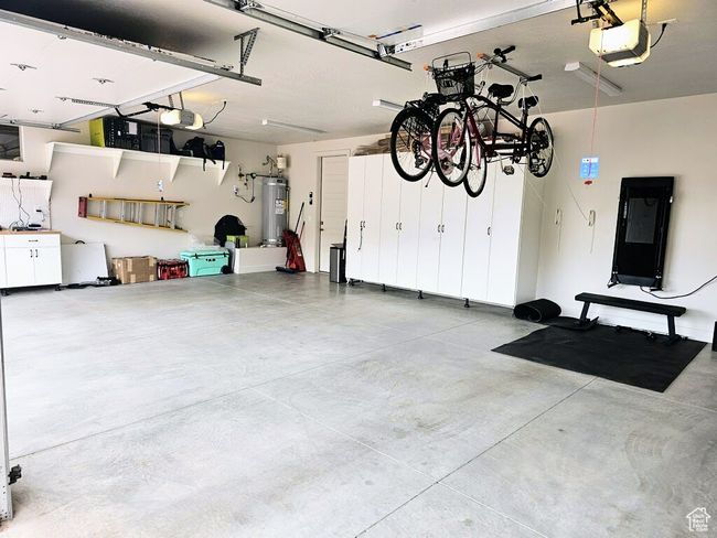 Garage with water heater and a garage door opener | Image 32