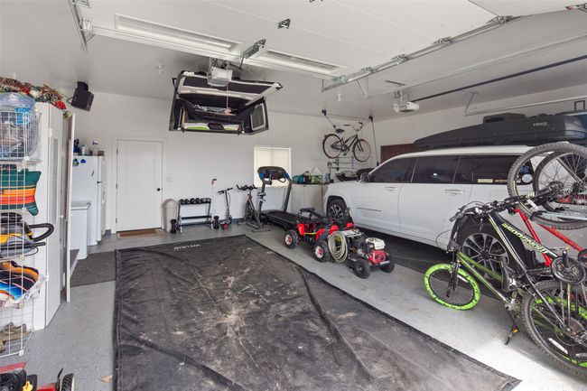 Large double garage w/back yard access & storage. | Image 52