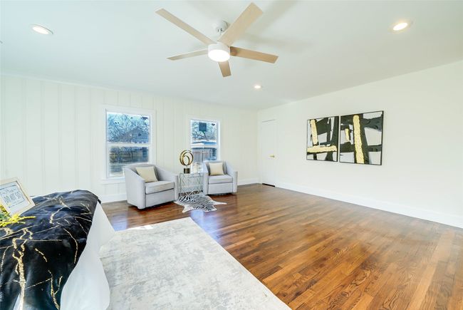 Sitting room featuring dark wood-type flooring and ceiling fan | Image 18
