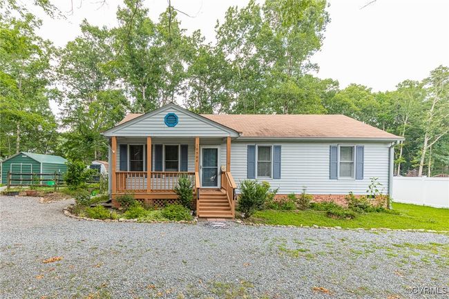 View of front of house featuring a porch, a shingled roof, and driveway | Image 36