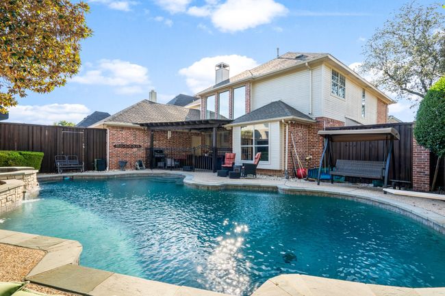 View of pool with a pergola, a fenced backyard, a pool with connected hot tub, and a patio | Image 29