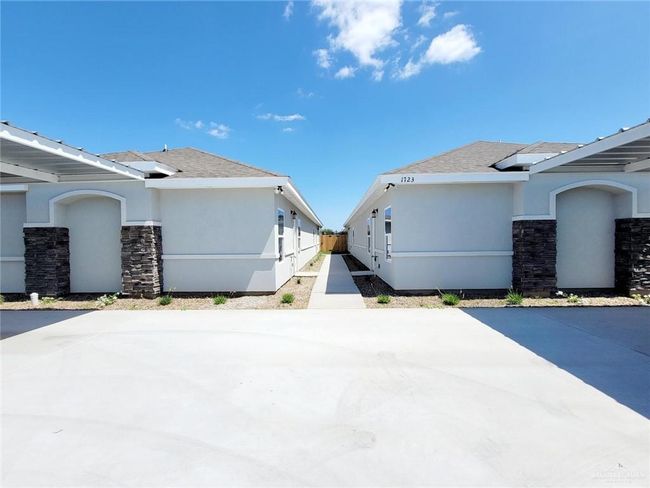 View of side of property featuring stucco siding and stone siding | Image 27