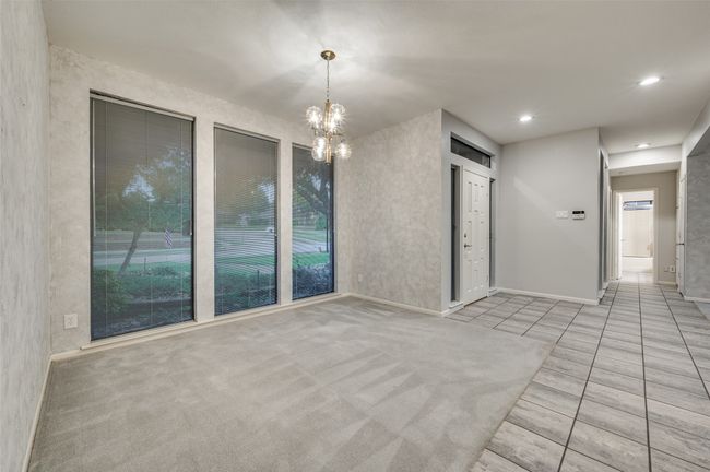 Dining room with floor to ceiling windows | Image 7