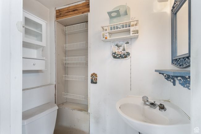 Half bathroom featuring a sink and toilet | Image 17