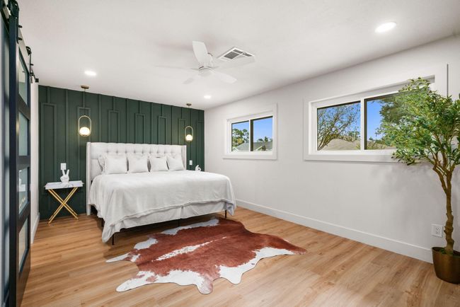 Bedroom 4: Split plan offers the primary suite in its own wing | Image 19