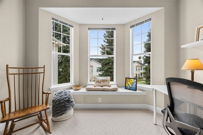 The 2nd bedroom is done in neutral tones and is currently used as a home art studio. | Image 28