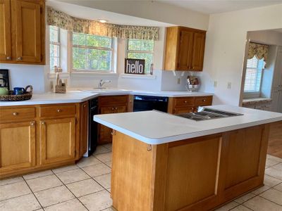 Cabinets and counters GALORE. The kitchen is centered between the breakfast nook and the formal dining room. | Image 3