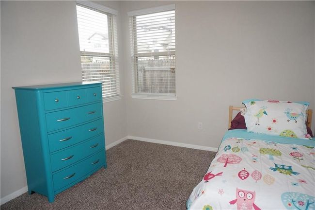 Carpeted bedroom with baseboards | Image 9
