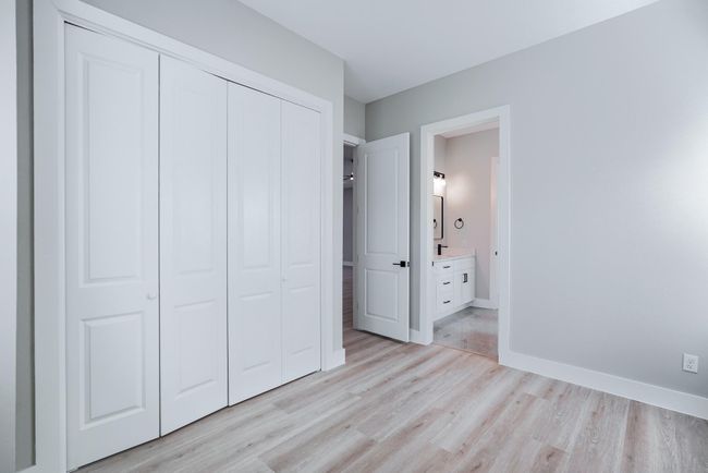 Comfortable guest bedroom with privacy and natural light | Image 29