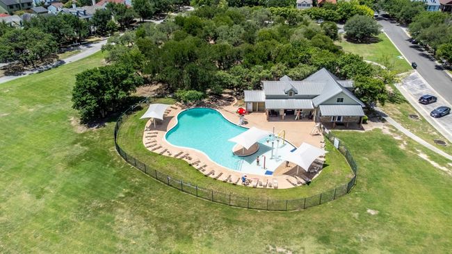 Community pool (resort-style) with built-in splash pad and beach entry. | Image 35