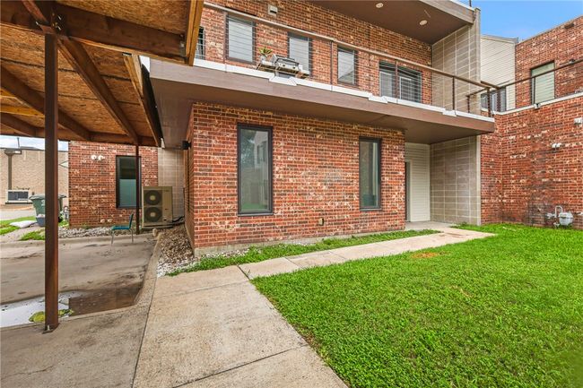 View of front of property with a balcony, a front lawn, and brick siding | Image 35