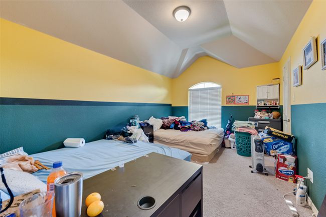 Carpeted bedroom with vaulted ceiling | Image 23