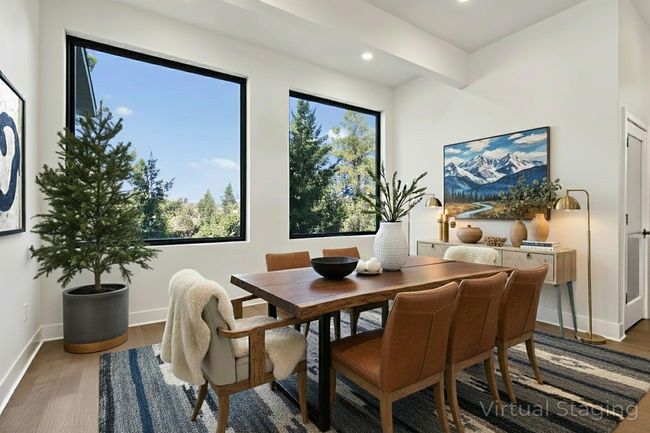 Dining area with large picture windows (virtually staged) | Image 18