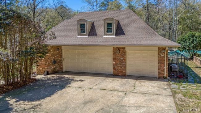 3 car garage with new doors and control openers installed in March 2025. The single car garage is a separate room. | Image 72
