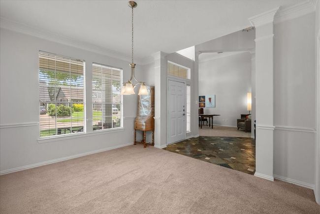 Do you enjoy entertaining? This formal dinning room is situated just off the kitchen for ease in moving between spaces. | Image 14
