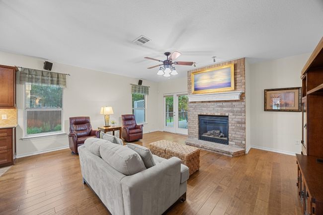 The living room is connected to the kitchen. | Image 18