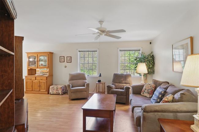 Living room with ceiling fan & laminate flooring | Image 6