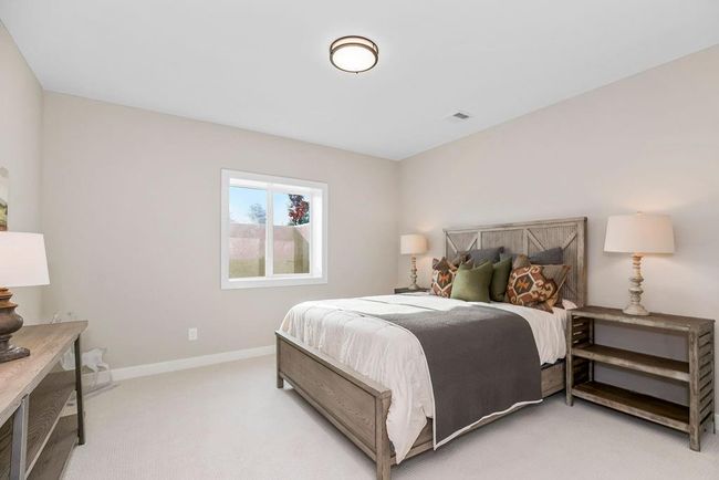 Lower level Rec area with 2 bedrooms and full bath. Photos of previous model home. Not actual listing. Features and sizes may vary. Contact agent for details & showings! | Image 25