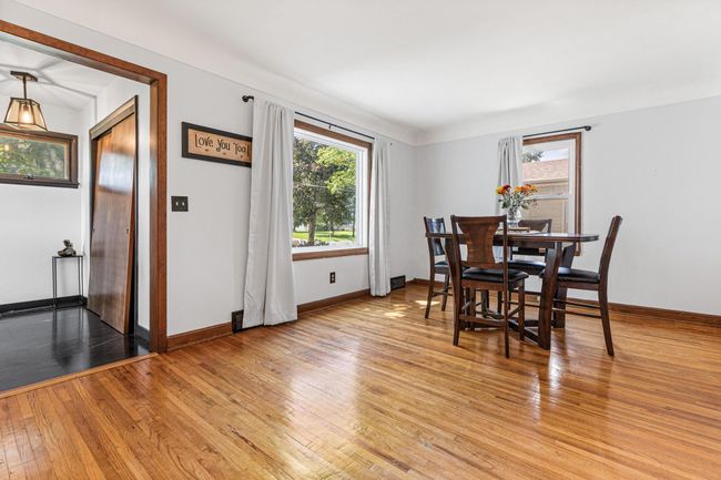 Entrywa with new flooring leads into dining room with bright picture window | Image 7