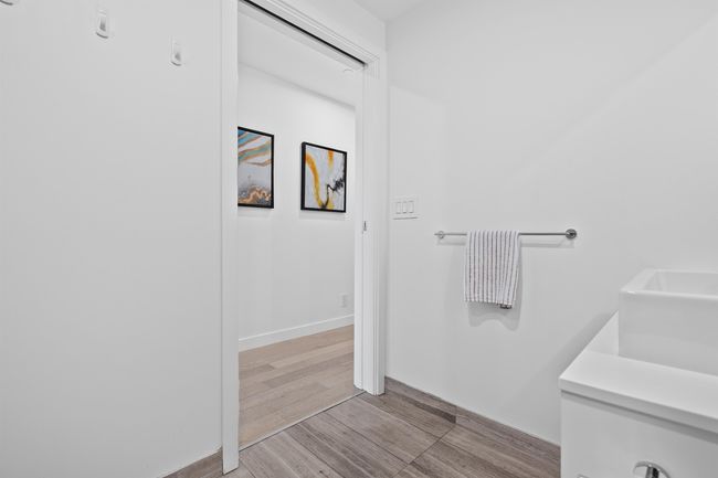 Bathroom featuring wood finished floors and baseboards | Image 16