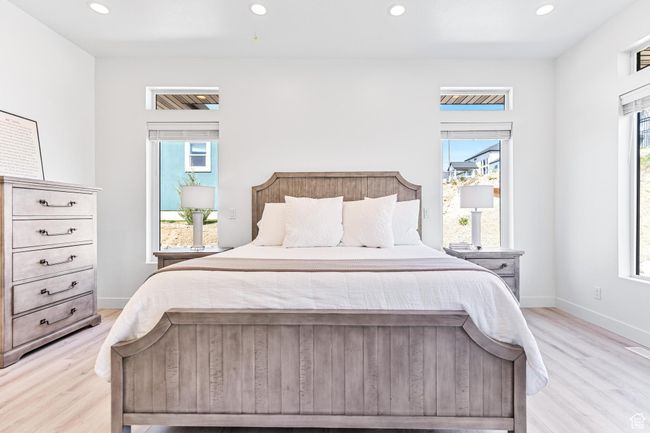 Bedroom featuring recessed lighting, light wood-type flooring, and baseboards | Image 21