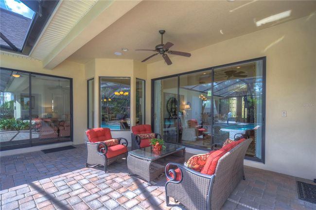 This inviting outdoor space offers direct access to a sparkling pool, perfect for both relaxation and lively gatherings. | Image 29