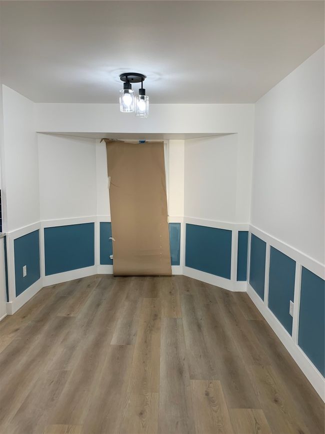 Spare room with wood finished floors | Image 7