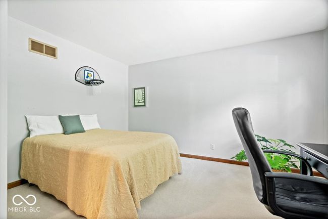 bedroom with light carpet and baseboards | Image 28