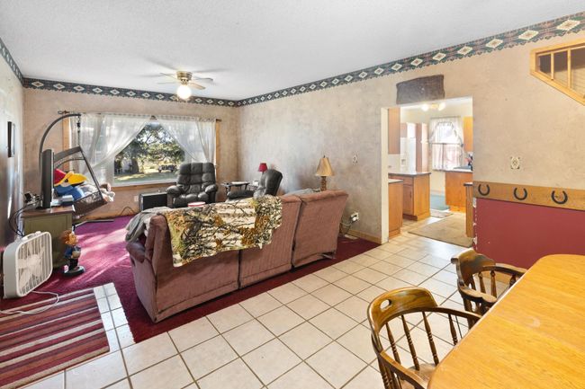 Living room with large east facing window. | Image 7